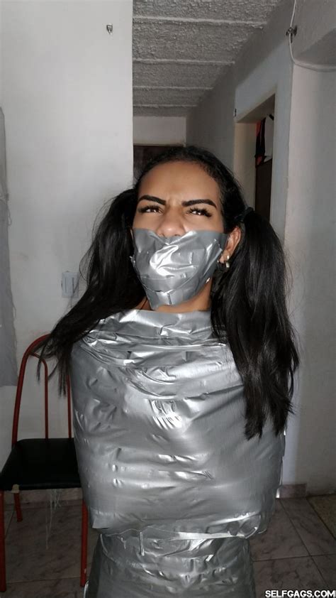 Extreme deep blowjob with duct tape tied hands and legs and cum inside throat with cute brunette. . Tied upporn